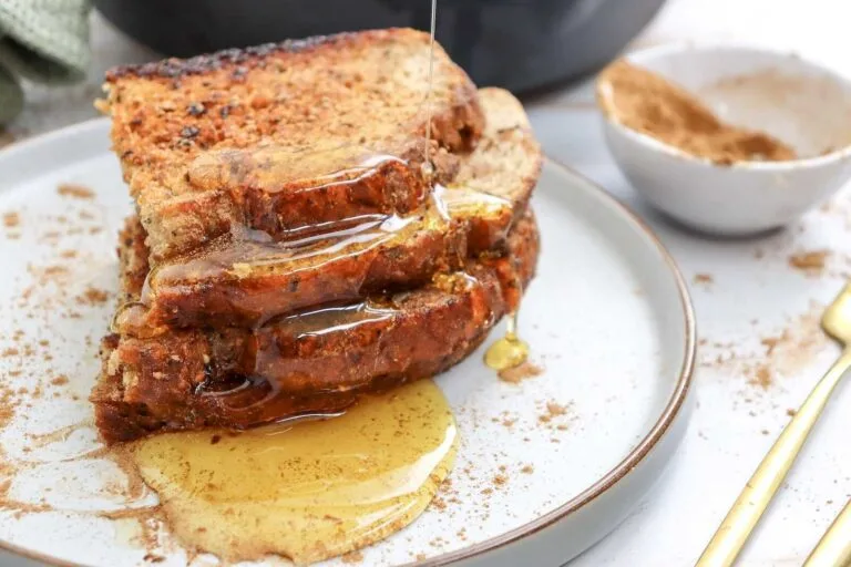 Maple syrup poured over stacked sourdough cinnamon sugar toast.