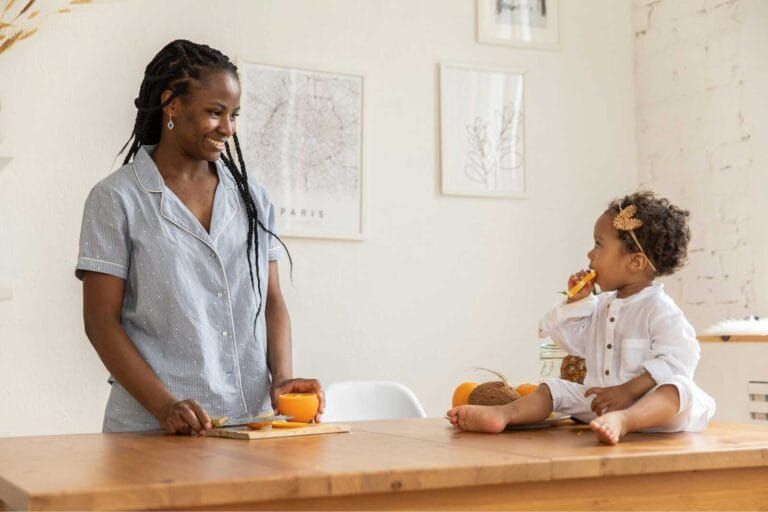 Mom affirmations written in a journal beside coffee, encouraging daily positivity and confidence for mothers.
